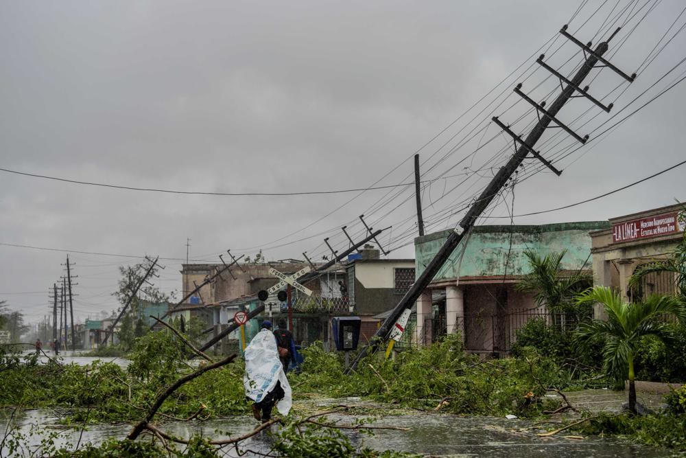 Hurricane Ian strikes Cuba, Florida braces for winds, floods